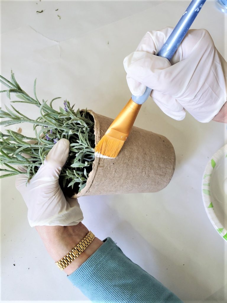 painting-the-gesso-on-the-paper-pot