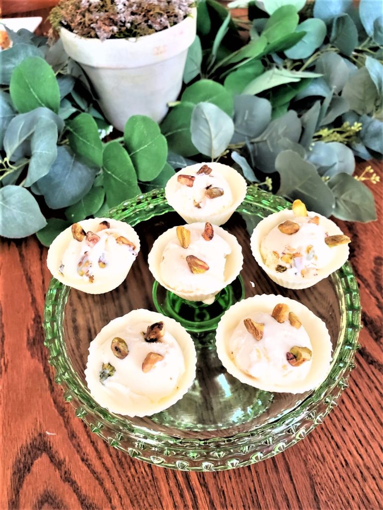 White chocolate cups with pistachio ice cream