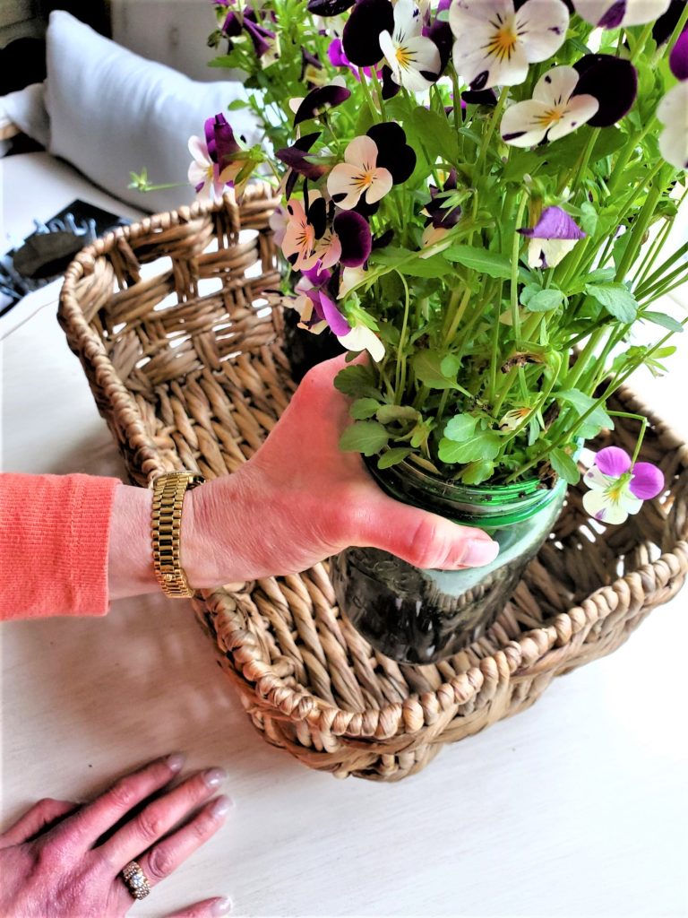 adding the jars to the basket once filled with water