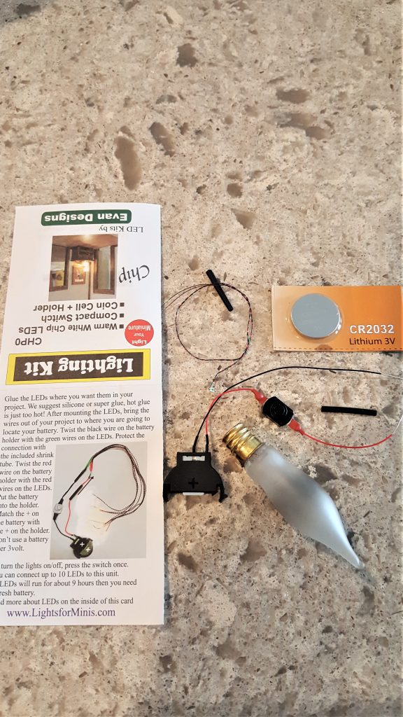 lighting kit parts and old bulb for the How To Make Flameless Candle DIY
