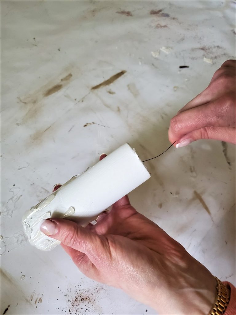 adding the the light to the candle for the How To Make Flameless Candle DIY