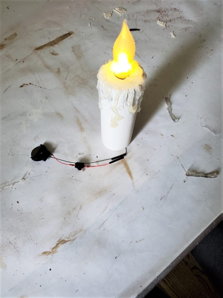 showing the How To Make Flameless Candle DIY lit