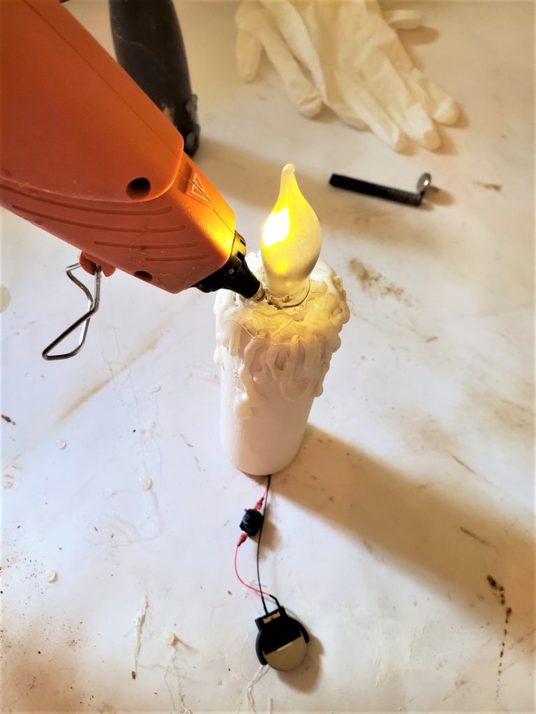 adding the glue around the bulb to hold it in tightly