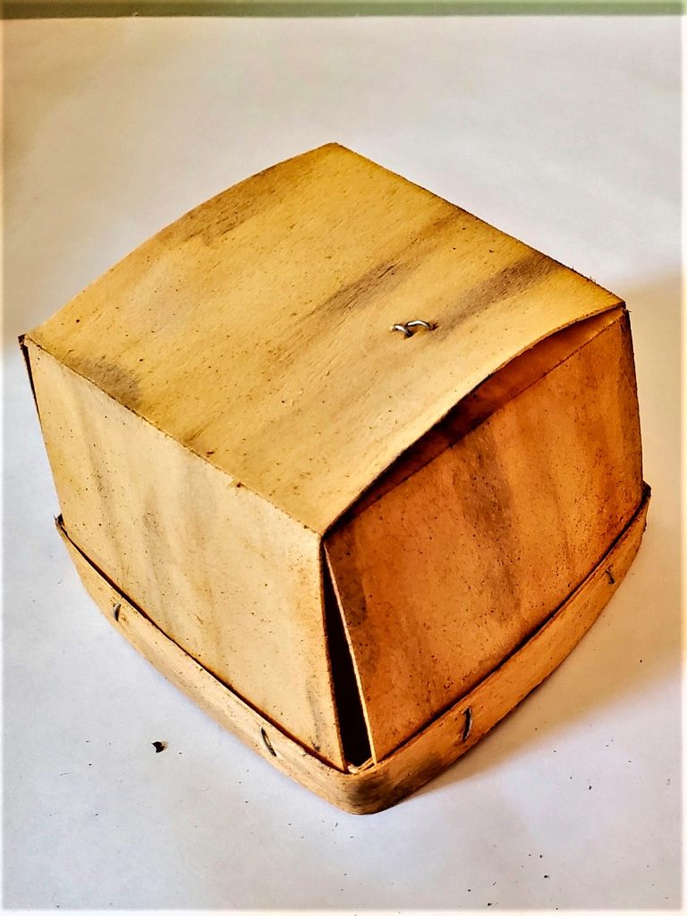 container after painted with tea for staining