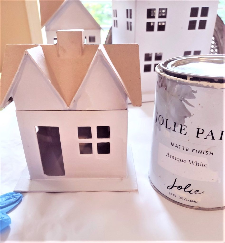 Easy DIY snowy houses getting second coat added to cover well