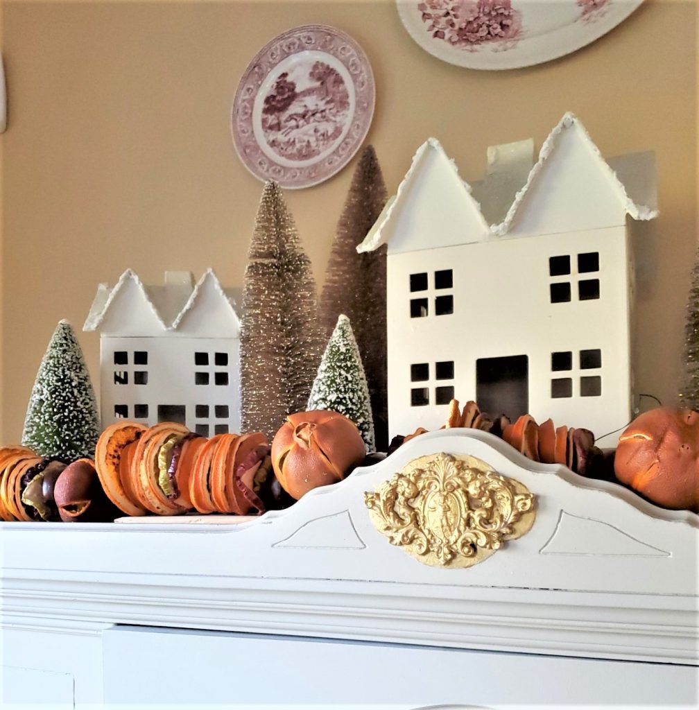 finished easy diy snowy houses with dried orange fruit garland
