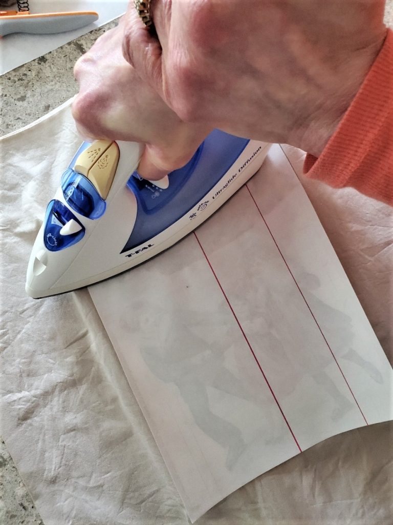 ironing on the iron on transfer make sure you push down very well to make the graphic stick