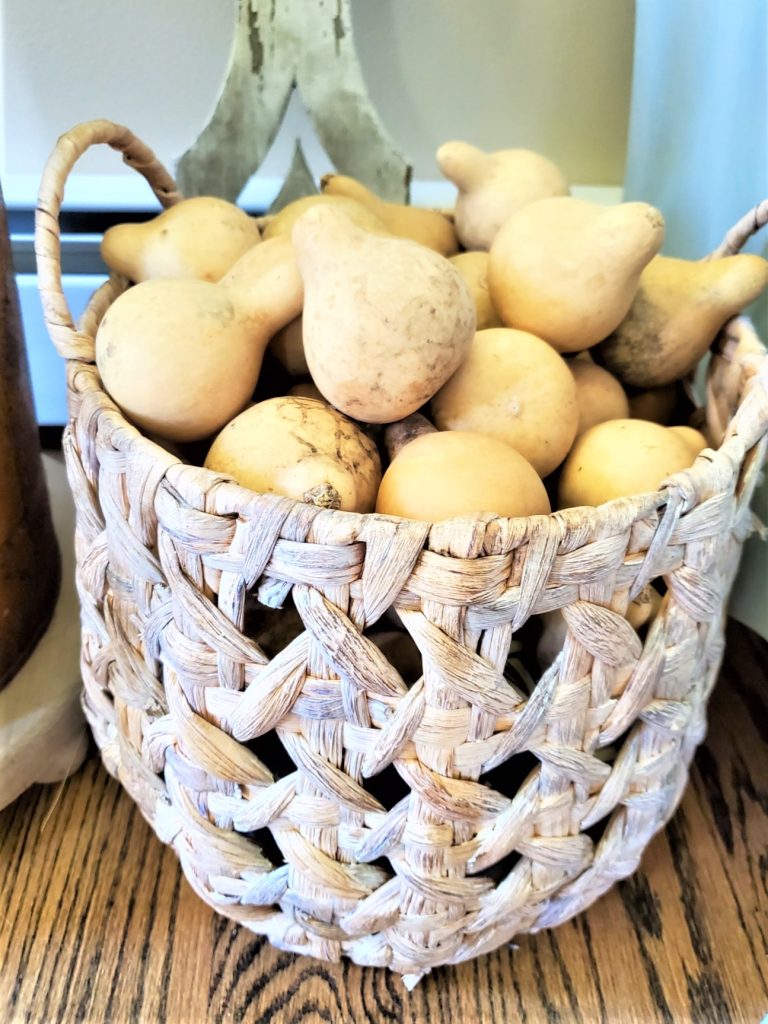 close up of basket and gourds for basket decor ideas