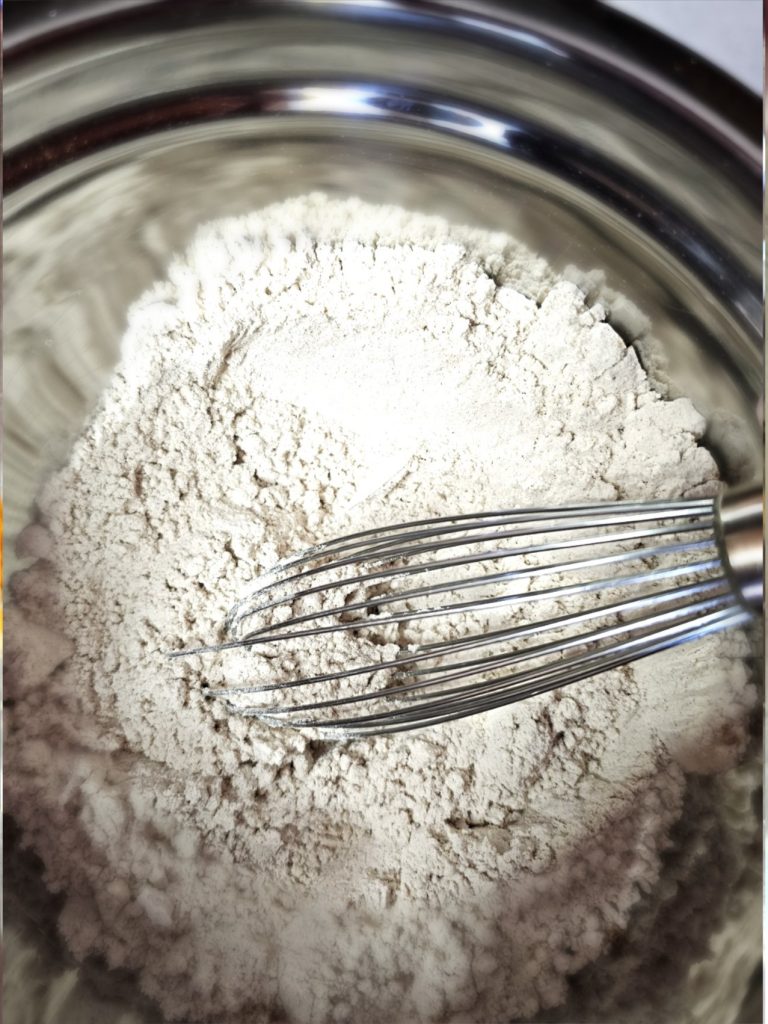 whisking-flour-salt-baking-powder-and-spices