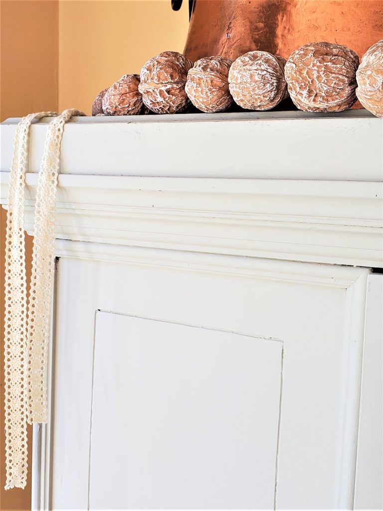garland on top of a china cabinet