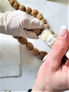 dry-brushing-the-shell-fall-walnut-garland