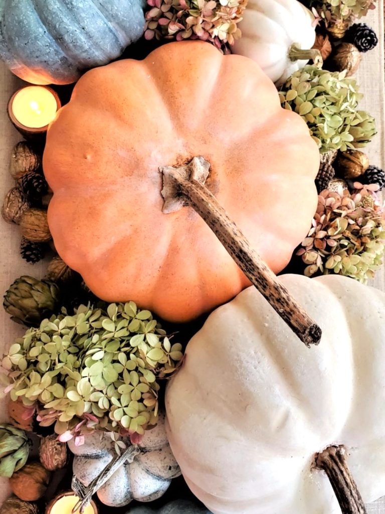 fall-centerpiece-ideas-on-a-budget-pumpkins-with-hydrangeas-and-candles
