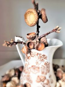 closer-look-at-caps-and-sticks-displayed-in-a-pitcher-clean-and-bake-branches-too-to-add-as-decor-and-napkin-rings