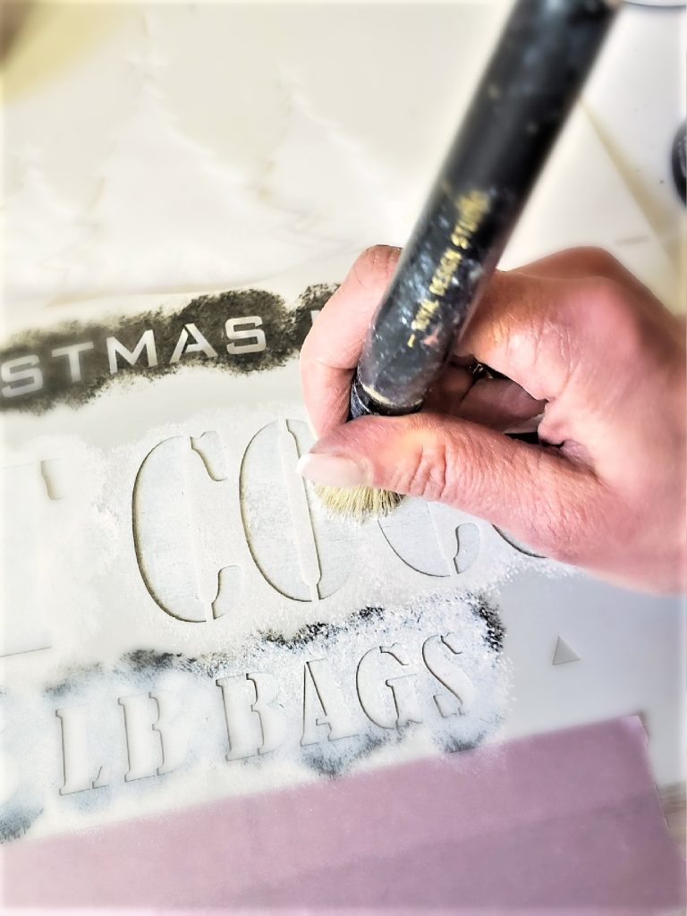 reverse-side-of-sign-stenciling-white-paint