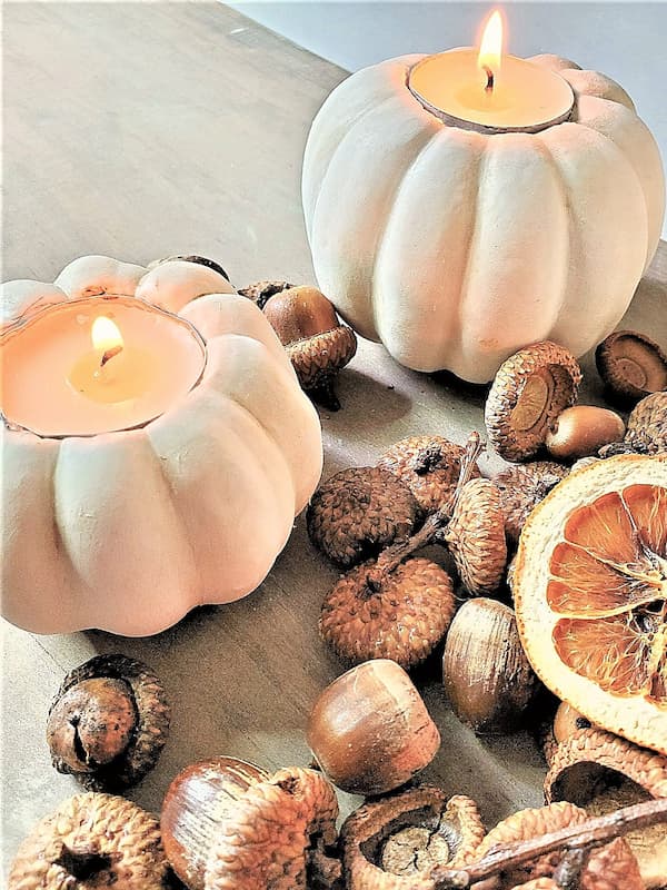 two-pumpkins-lit-with-dried-orange-slices-and-preserved-real-acorns
