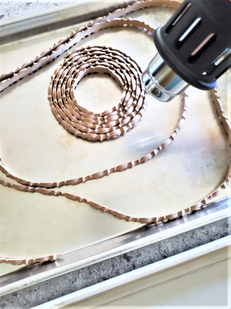 heating the trim with a heat gun