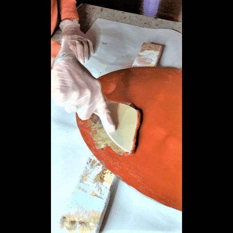 Rubber scrapper taking off the second layer