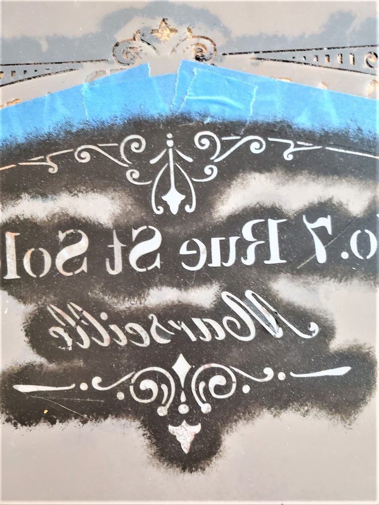 stencil in reverse so it faces the right direction when hanging on the wall