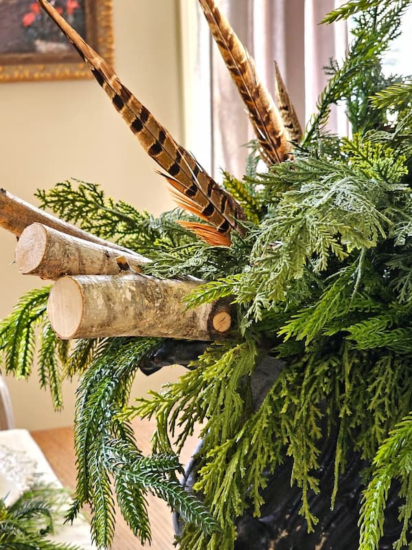 12-Symbols-of-Christmas-and-What-They-Really-Mean-birch-logs-and-greens-feathers