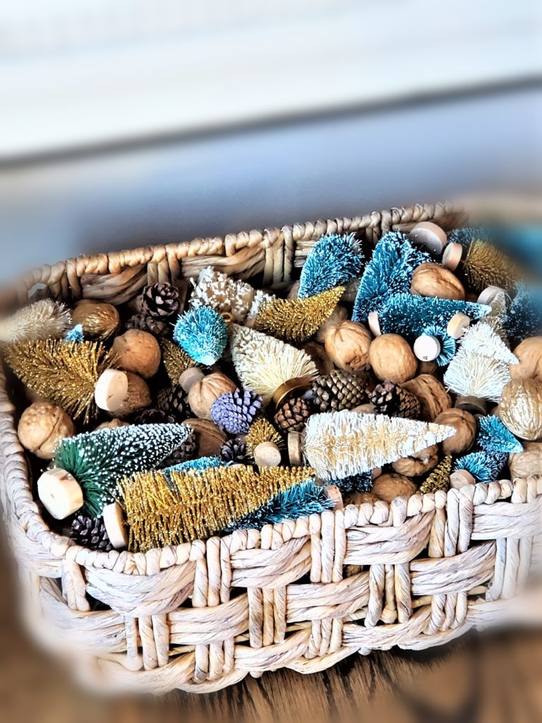 Assorted Small and Mini Bottle Brush Trees in a Basket under the Hutch