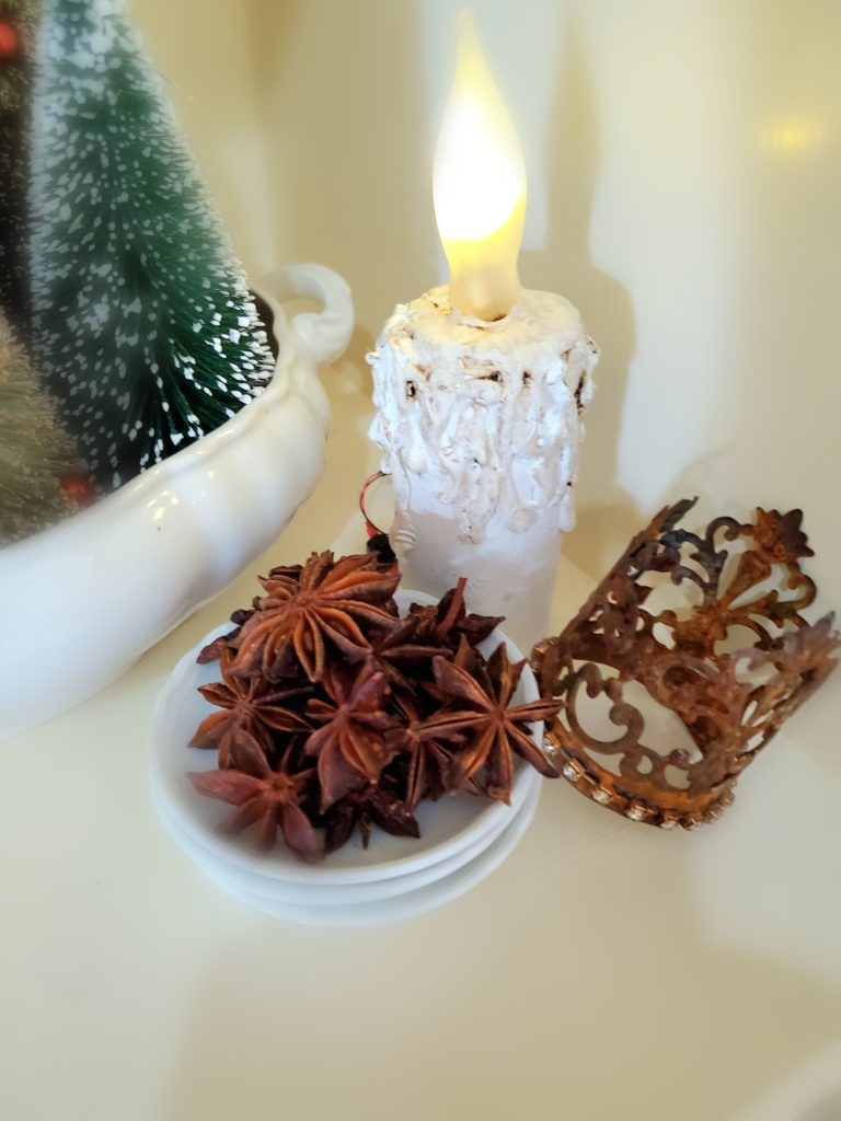 Star anise with a flameless candle and small crown
