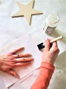 adding-mod-podge-to-the-back-of-the-star