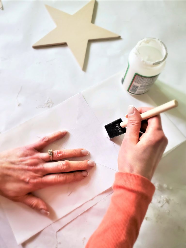 adding-mod-podge-to-the-back-of-the-star
