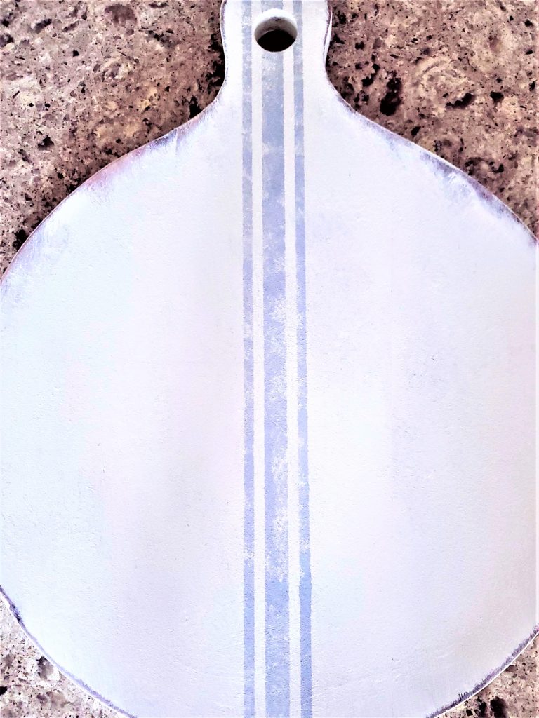 showing the sanded edges of the DIY Christmas signs and grain sac image