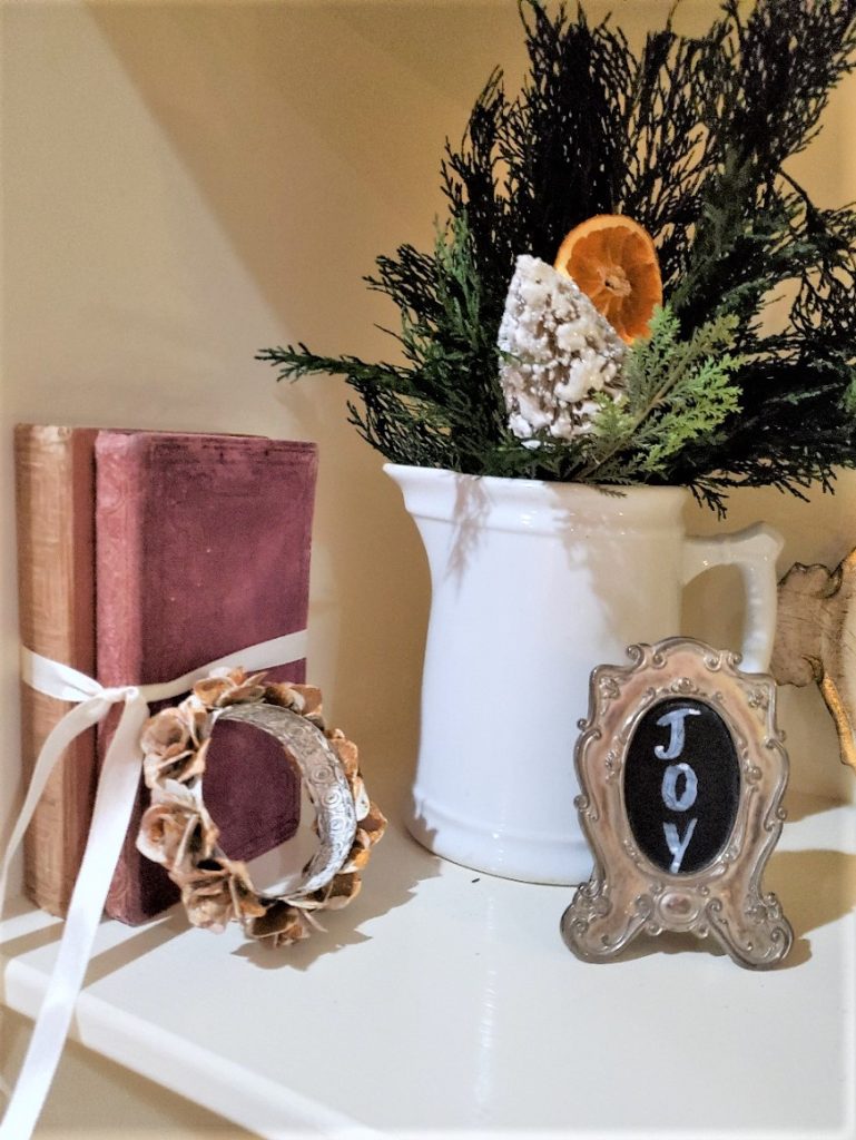 Christmas Greens in a Vintage Inronstone Pitcher with Bundled French Book and Crown