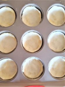 biscuits-split-in-half-dipped-in-butter-and-inside-the-pan