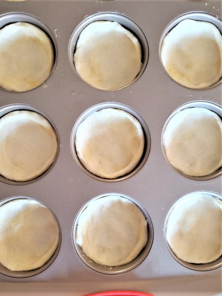 biscuits-split-in-half-dipped-in-butter-and-inside-the-pan-easy-delicious-mini-Kolaches-recipe