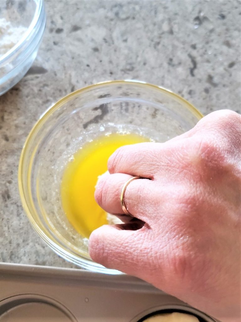 dipping-the-biscuit-top-in-butter-easy-delicious-mini-Kolaches-recipe