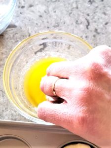 easy-mini-kolache-recipe-me-dipping-biscuit-into-butter