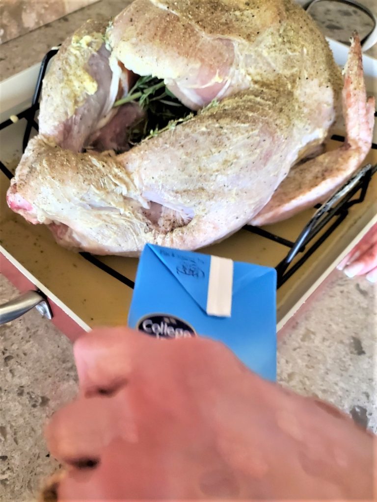 adding-chicken-stock-to-roasting-pan