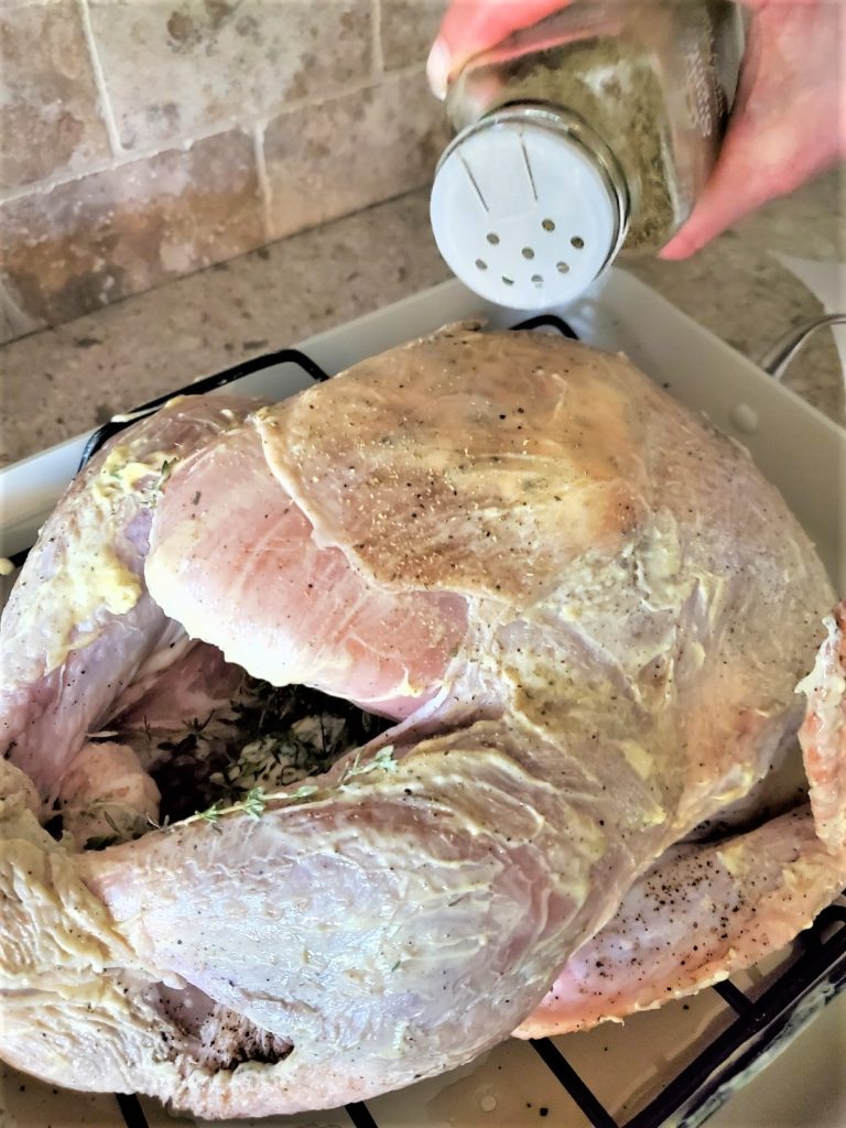 thyme-turkey-cavity-adding-sage-seasoning