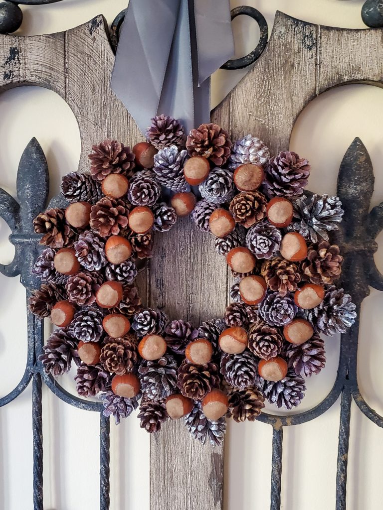 closeup-of-pine-cone-wreath-hanging