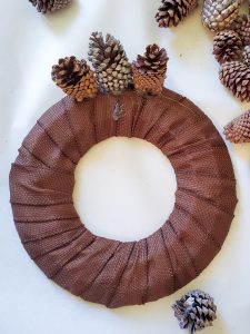 first-three-pinecones-glued-to-wreath