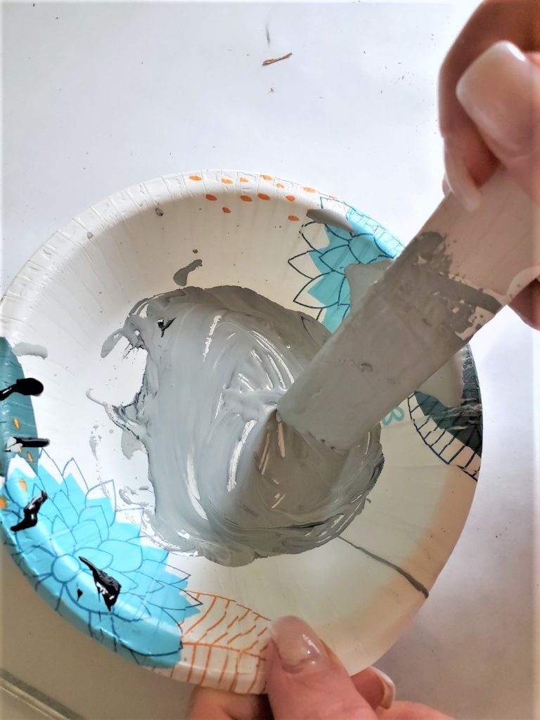 mixing-dot-of-black-paint-make-dark-gray