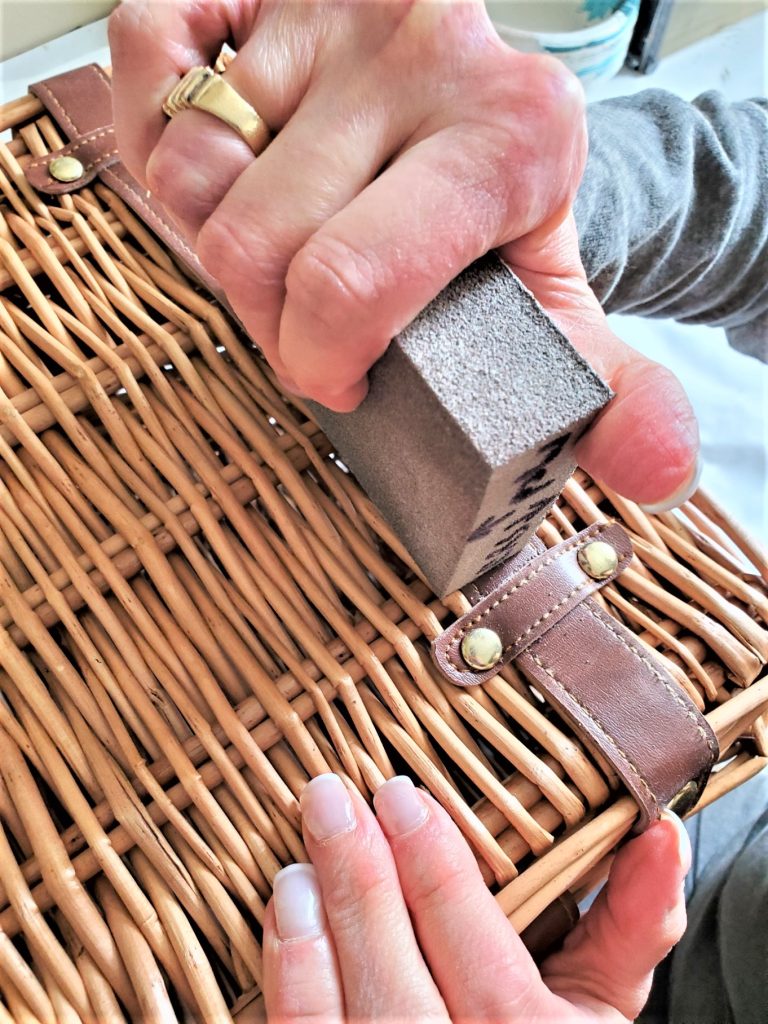sand-with-sanding-sponge-to-age-diy-picnic-basket