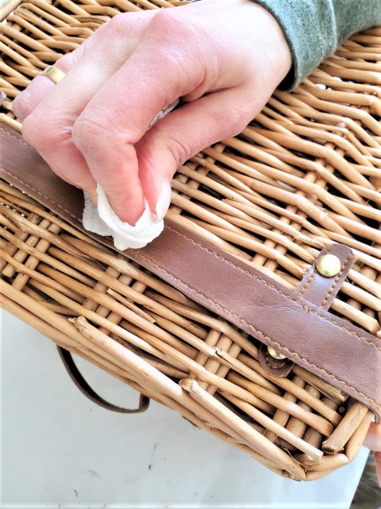 wiping-the-leather-clean-from-alcohol-with-cloth