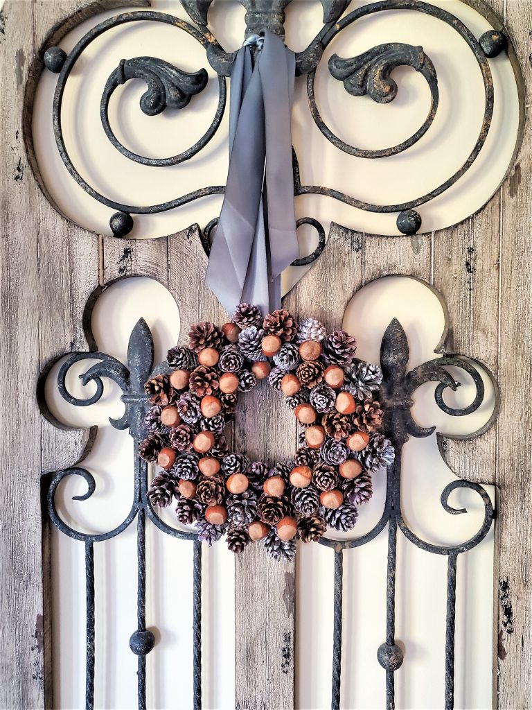 pinecone-wreath-hanging-on-gate