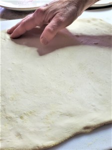 flattening-dough-easy-fig-jam-sausage-pizza