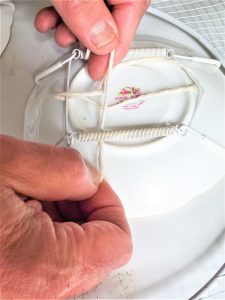 slipping-twine-through-wreath-craft