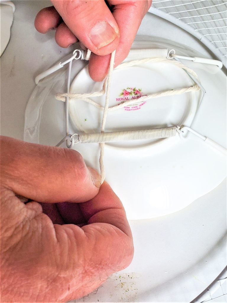 slipping-twine-through-wreath-craft