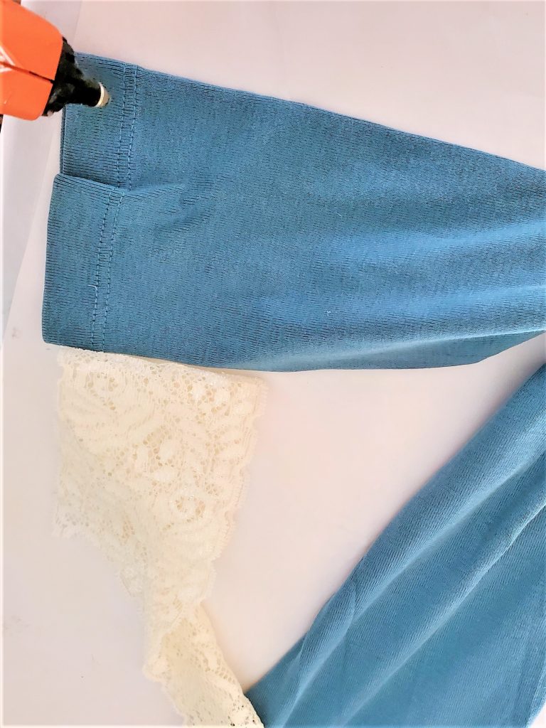 adding-hot-glue-to-shirt-sleeve-diy-scarecrow-for-fall