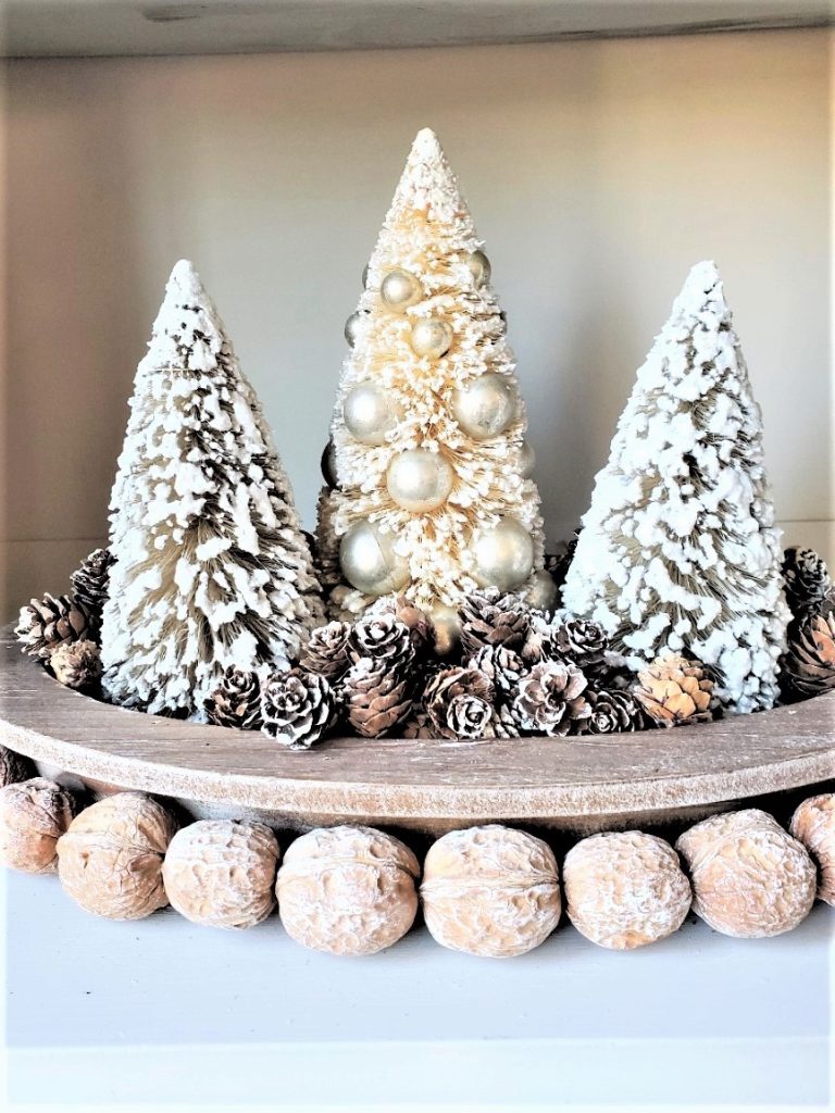 closeup-of-bottle-brush-trees-with-walnut-garland-old-fashioned-christmas