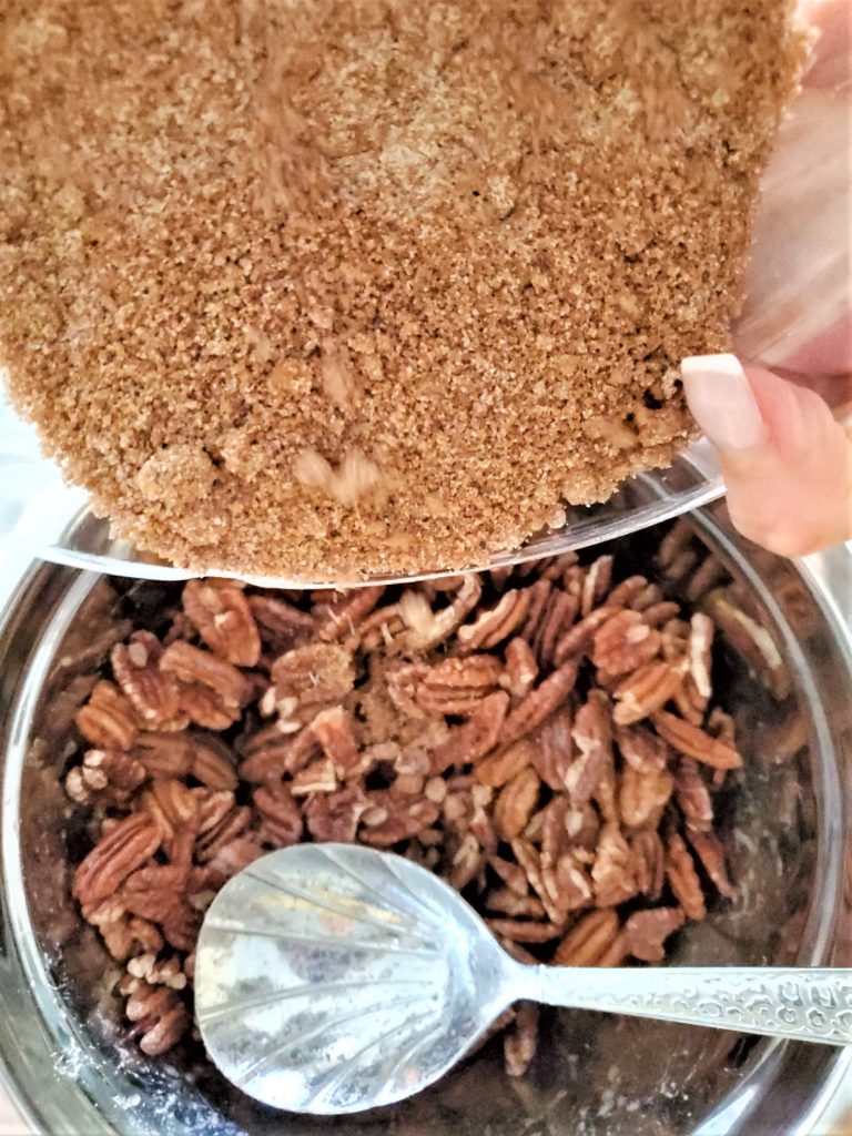 pouring-sugar-mixture-to-coat-pecans