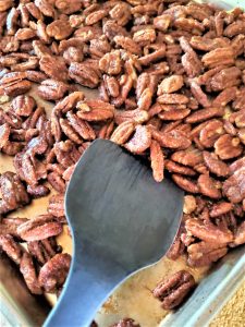 stirring-cinnamon-sugar-vanilla-pecans-after-15-minutes-of-baking