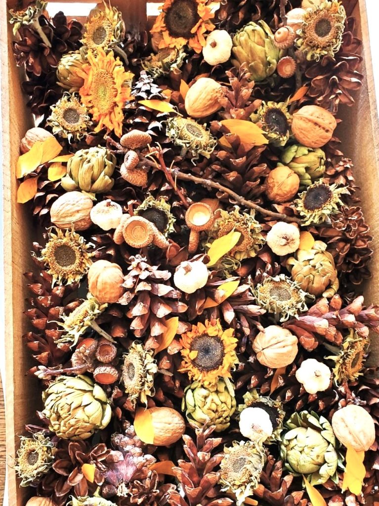 pinecones-acrons-nuts-sunflowers-in-a-wood-crate