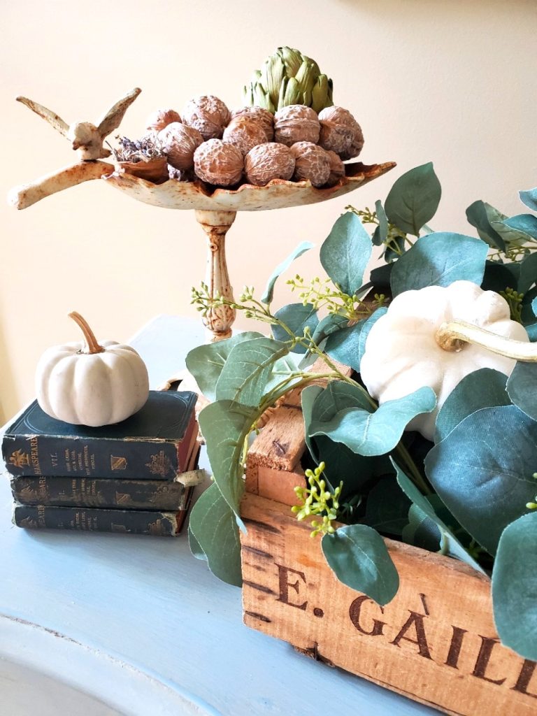 books-small-pumpkins-natural-wood-crate